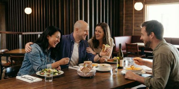 Fall foliage in Stowe, Vermont with colorful autumn trees surrounding mountain homes and rolling hills