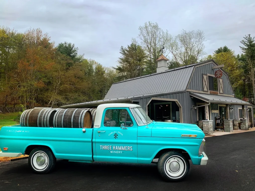 Old truck with wine barrels in the bed