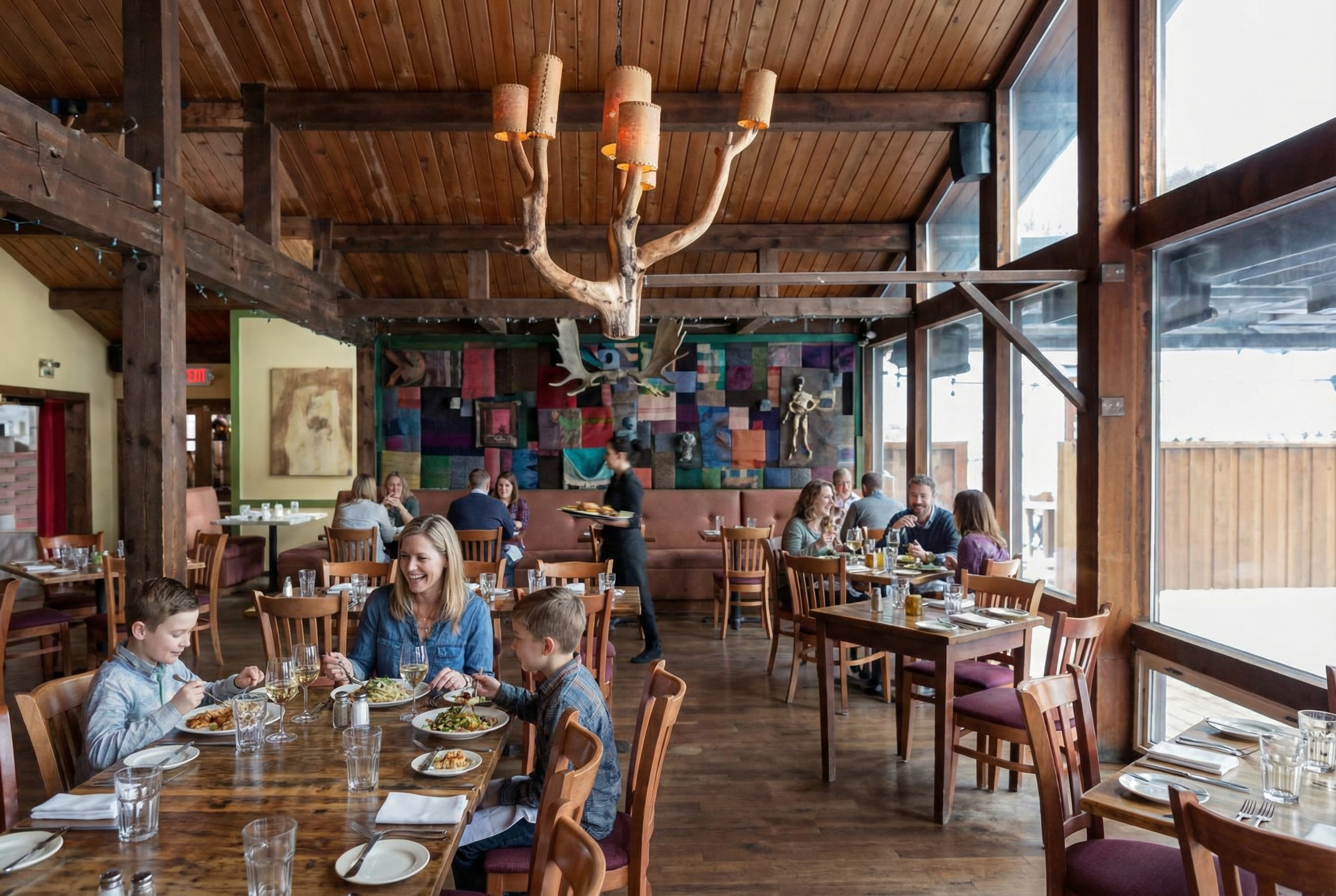 Fall foliage in Stowe, Vermont with colorful autumn trees surrounding mountain homes and rolling hills