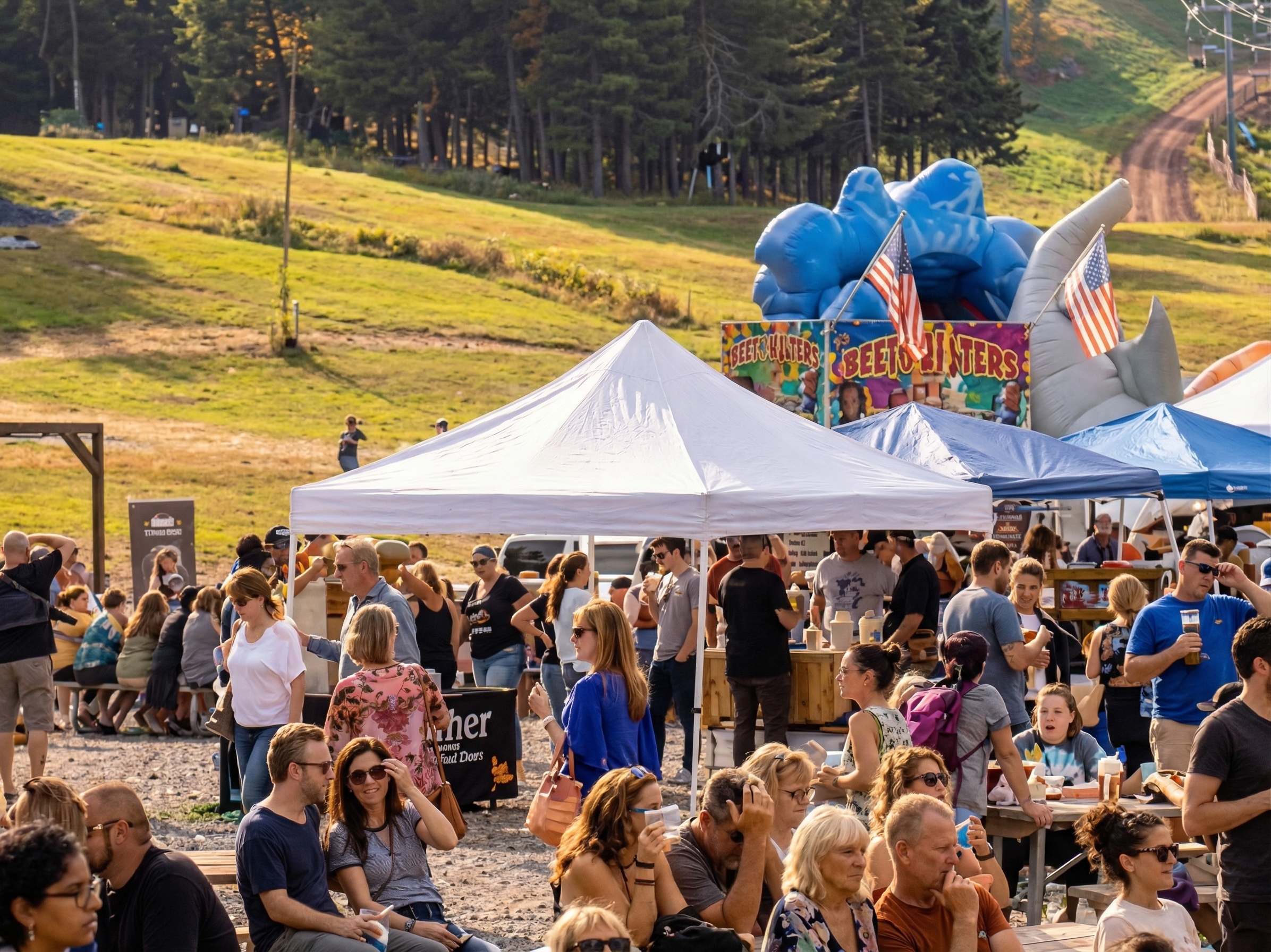 Group of friends sitting at an outdoor brewery table, enjoying craft beer and conversation with mountain views in the background