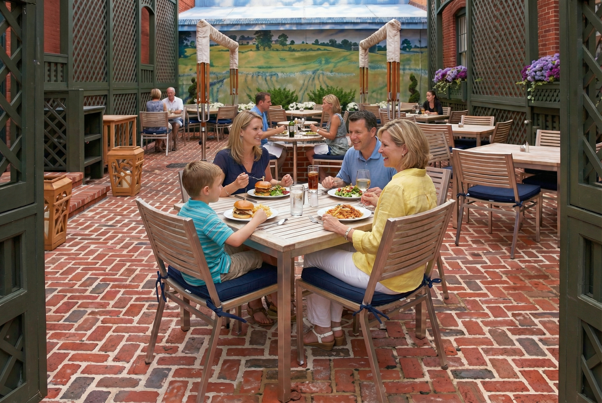 Large wheels and slices of artisan cheese displayed on a wooden counter at a Vermont market